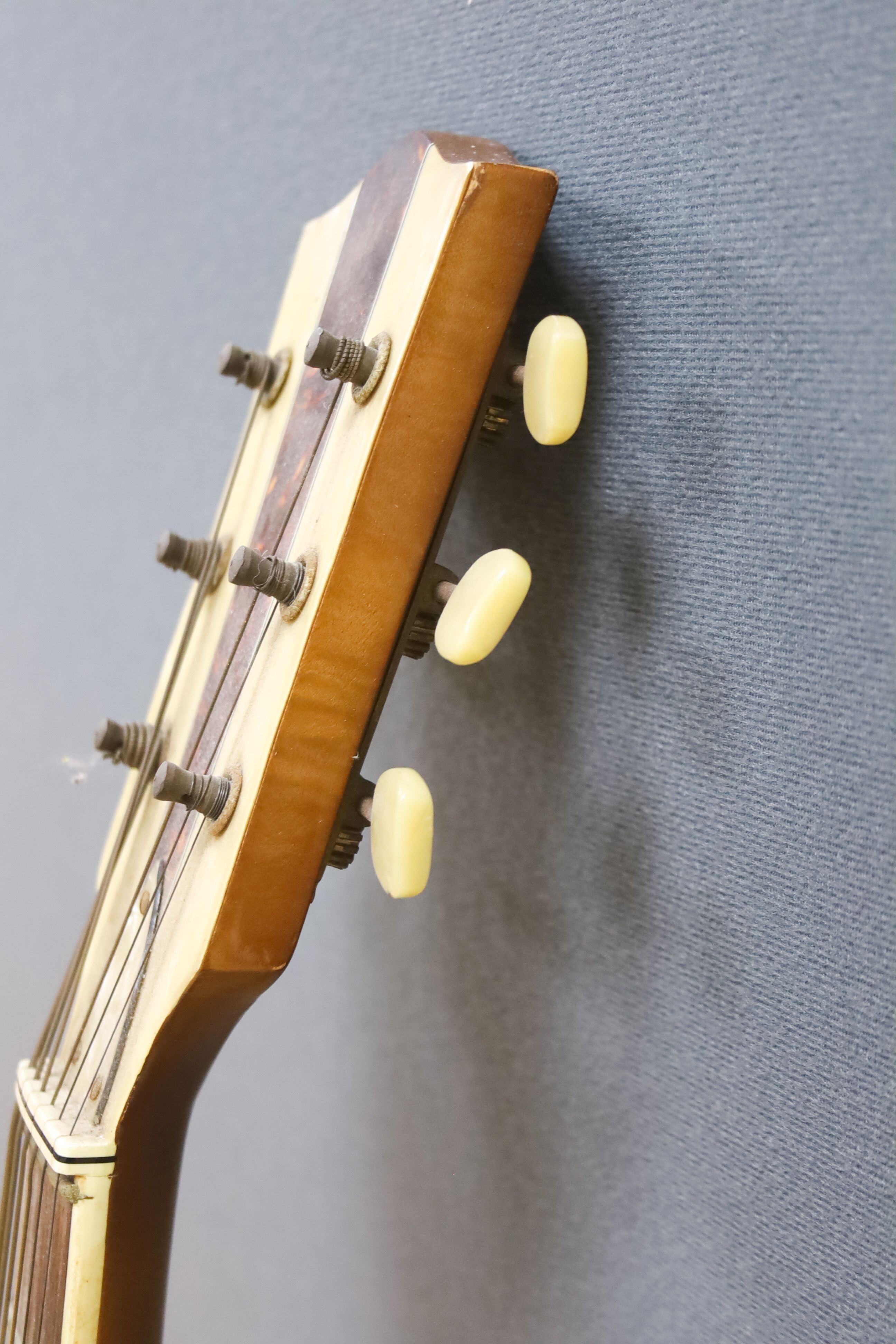 A Hofner acoustic f-hole guitar, circa 1950, having mother of pearl and tortoiseshell inlay to fret and head